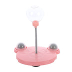 Educational cat toy with a food dispenser and spring-loaded rocking design