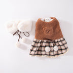 Plush dog clothes with a plaid skirt and scarf