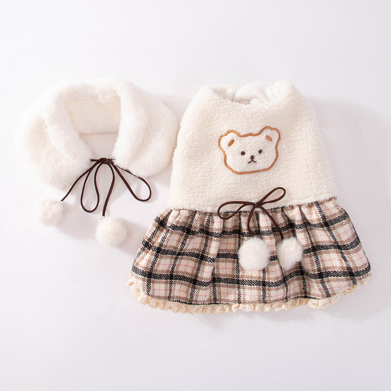 Plush dog clothes with a plaid skirt and scarf