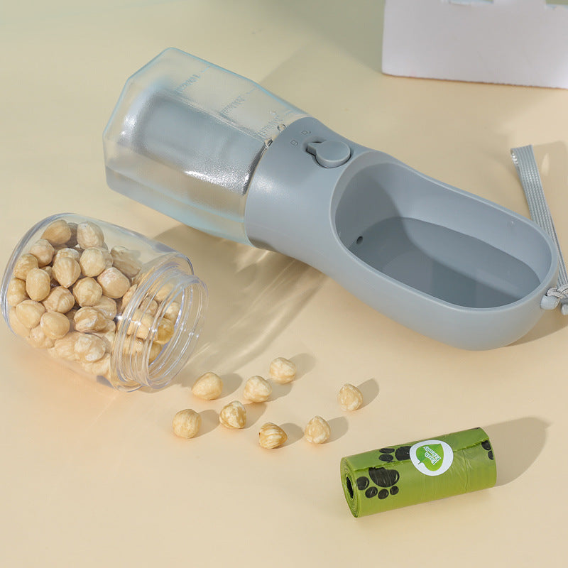 All-in-one pet travel cup with water and food compartment + poop bag dispenser