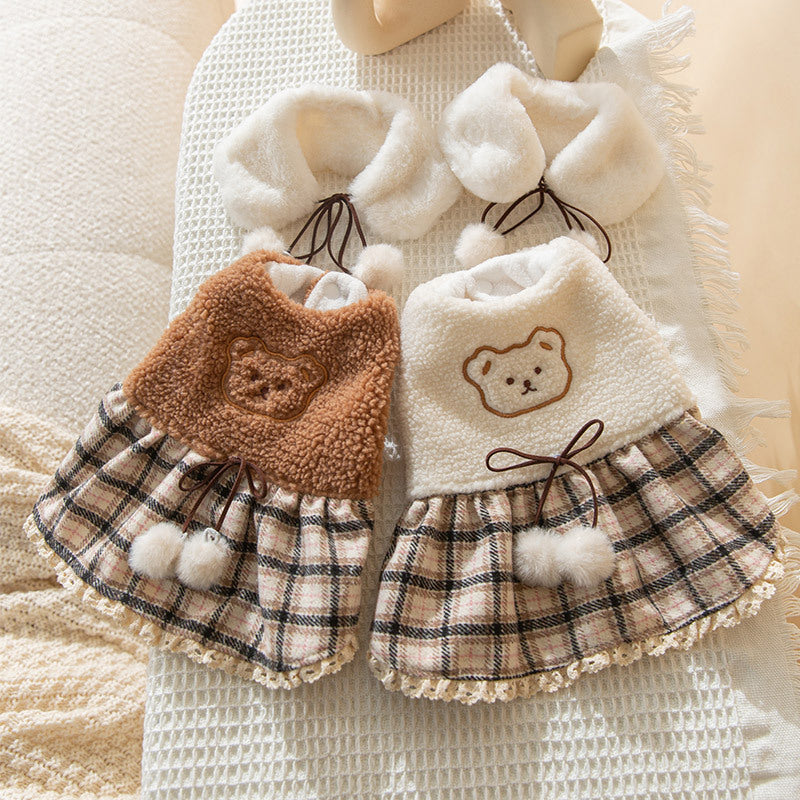 Plush dog clothes with a plaid skirt and scarf