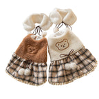 Plush dog clothes with a plaid skirt and scarf